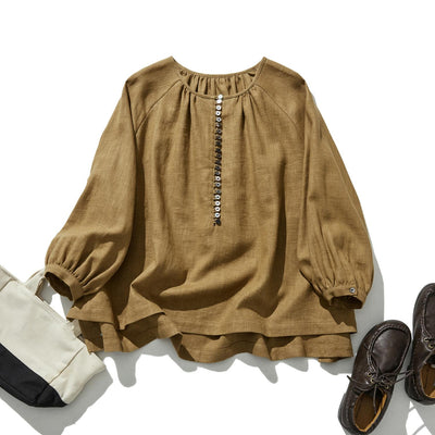 A cotton linen blouse with a captivating natural texture 240312